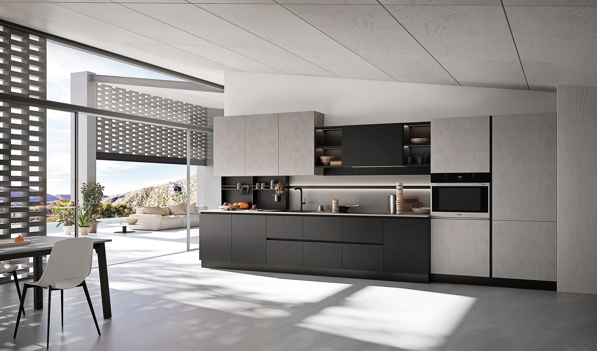 Cucina moderna e minimalista con mobili bassi scuri, pareti chiare e zona pranzo luminosa grazie alle ampie finestre.