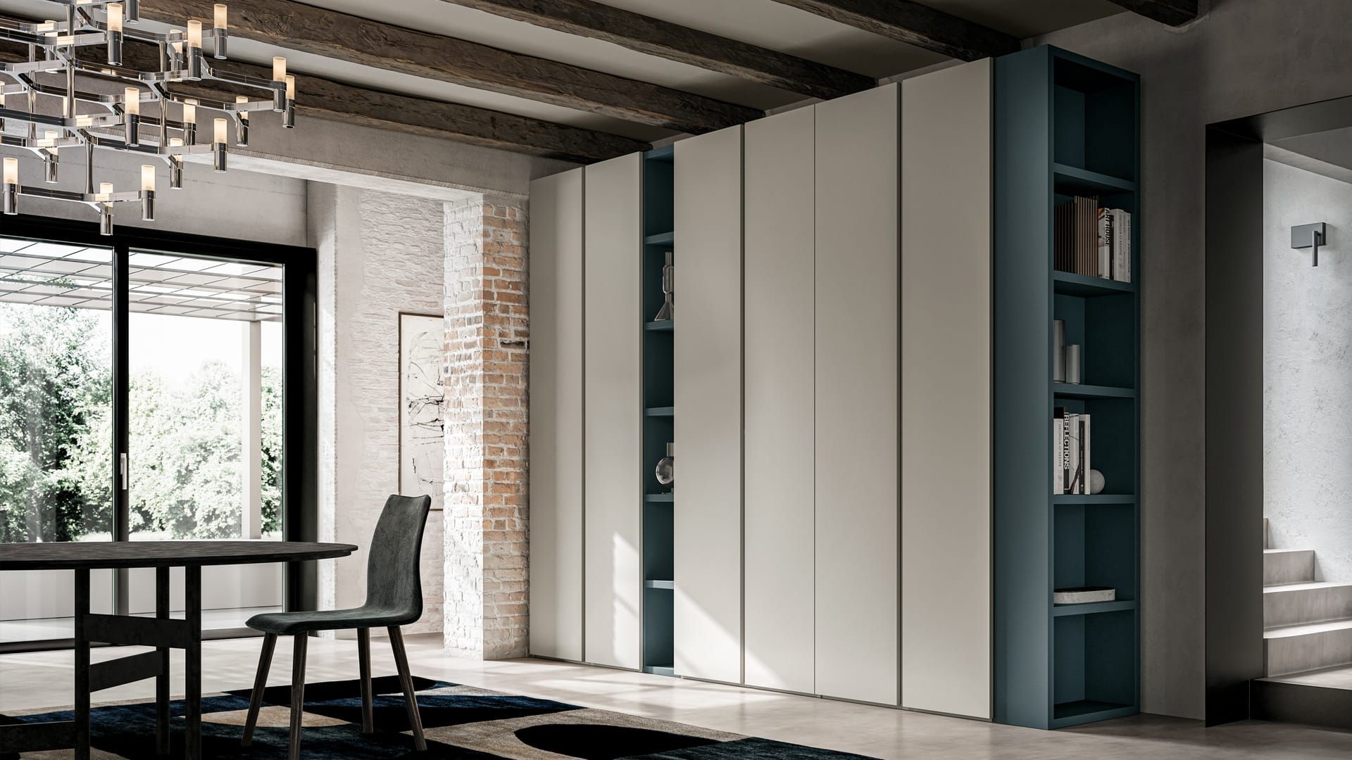 Zona pranzo in stile loft moderno con ampie finestre, tavolo e sedie neri e scaffalature bianche a muro.