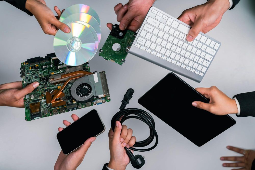 A group of people are working on a computer.