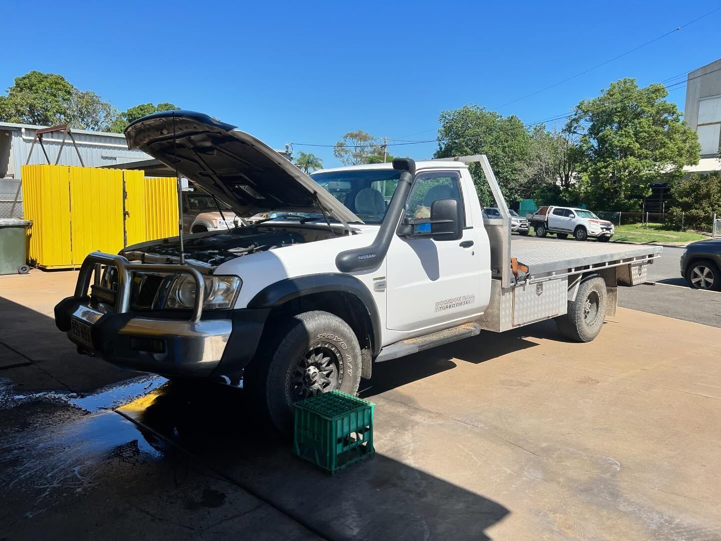 White Pickup Truck With Hood Up, on a Concrete Driveway — Bundaberg Radiator and Mechanical Service in Bundaberg East, QLD