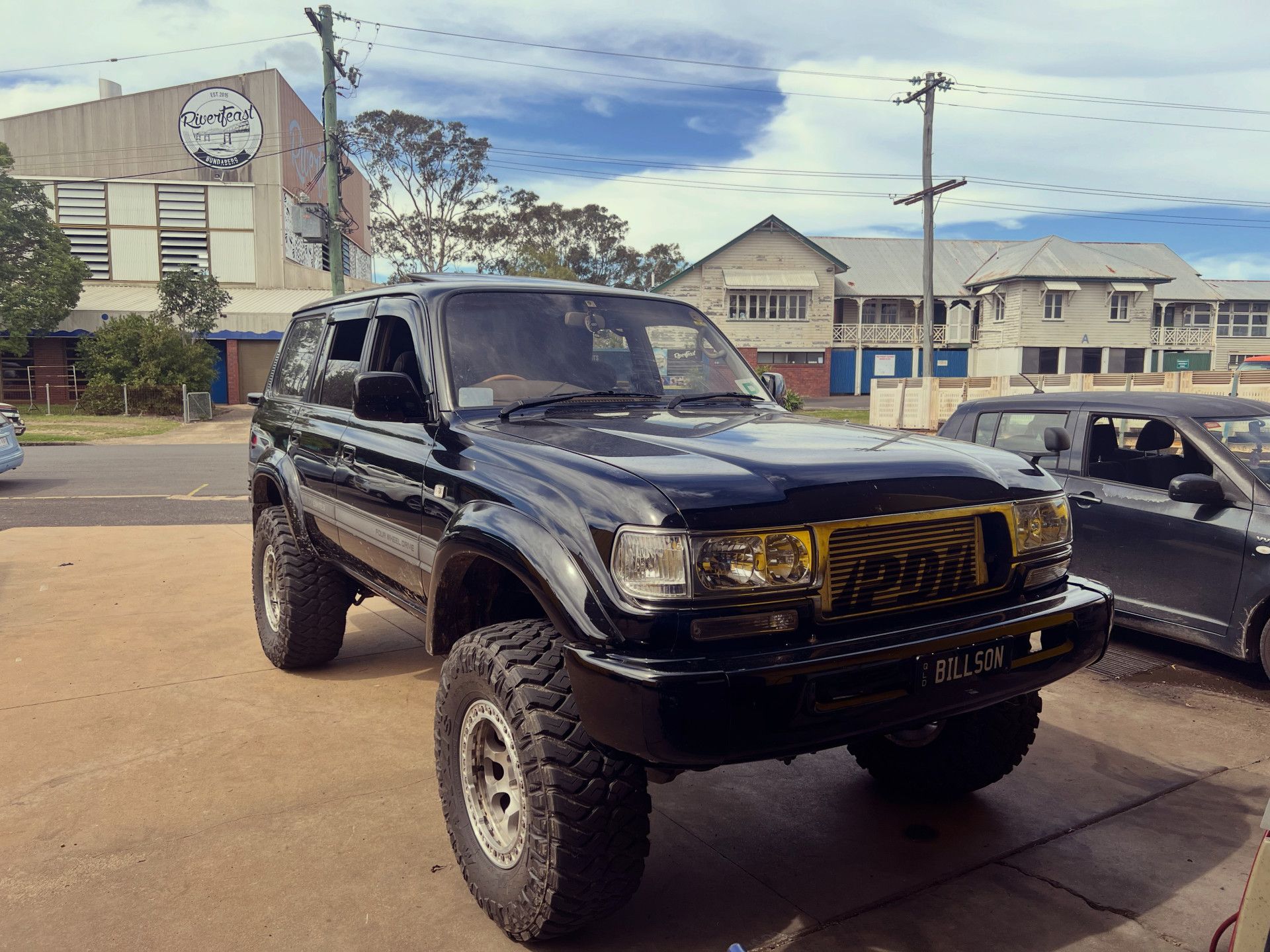 Black Lifted Suv With Large Tires — Bundaberg Radiator and Mechanical Service in Bundaberg East, QLD