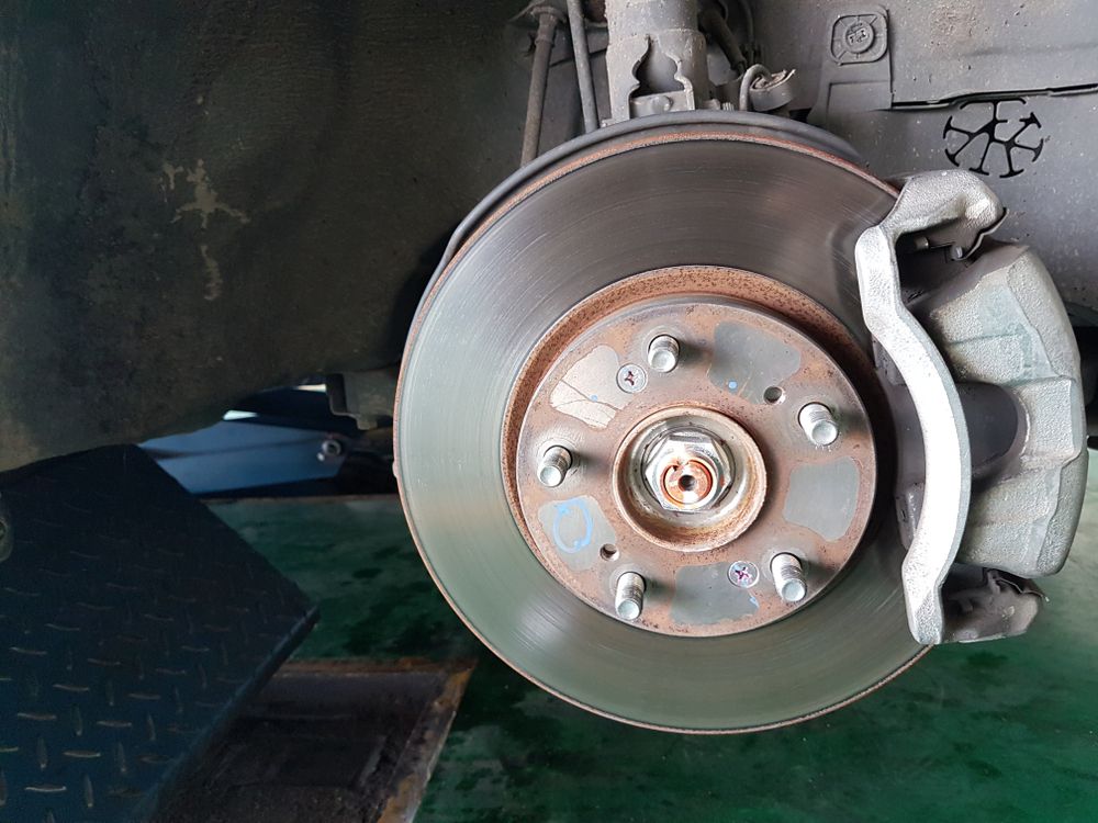 Car Brake Disc With Caliper, Hub, and Bolts — Bundaberg Radiator and Mechanical Service in Bundaberg East, QLD