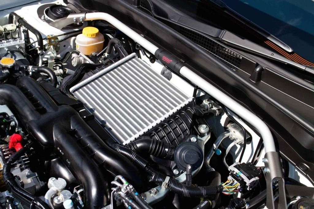 Car Engine Bay With Intercooler and Strut Bar — Bundaberg Radiator and Mechanical Service in Bundaberg East, QLD