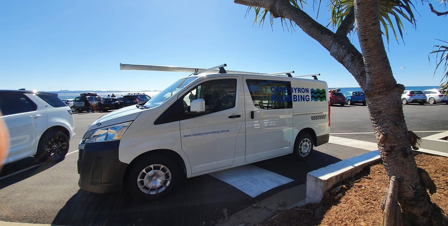 A van parked with a blue sky background, plumbing ballina
