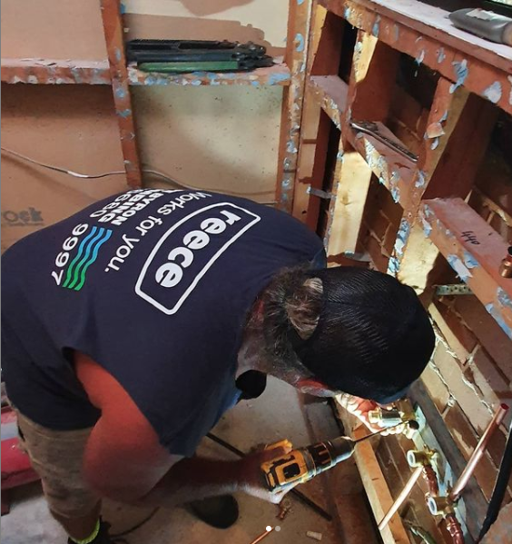 Plumber doing work — Cape Byron Plumbing in Byron Bay, NSW