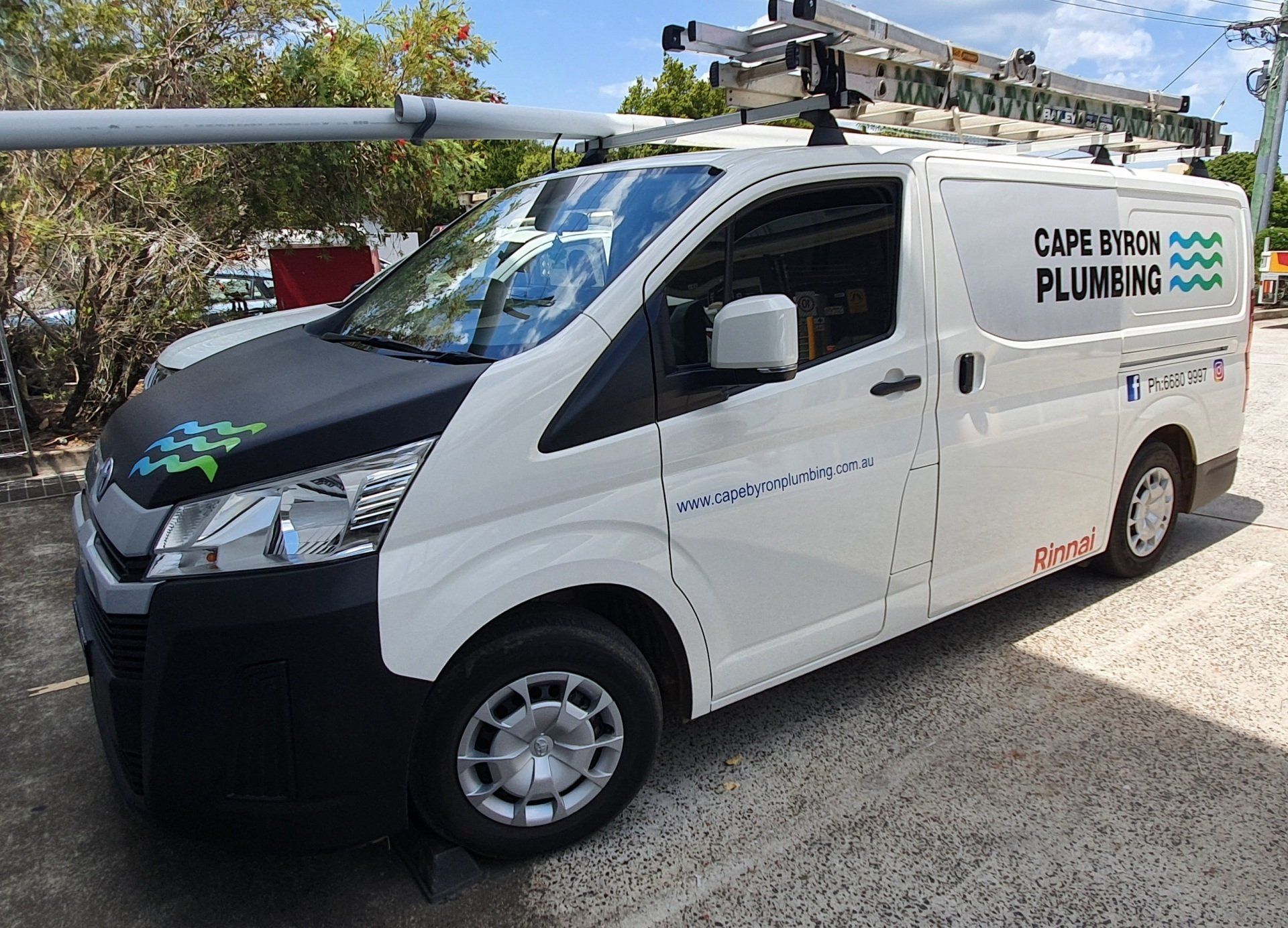A van with cape byron plumbing writing on the side