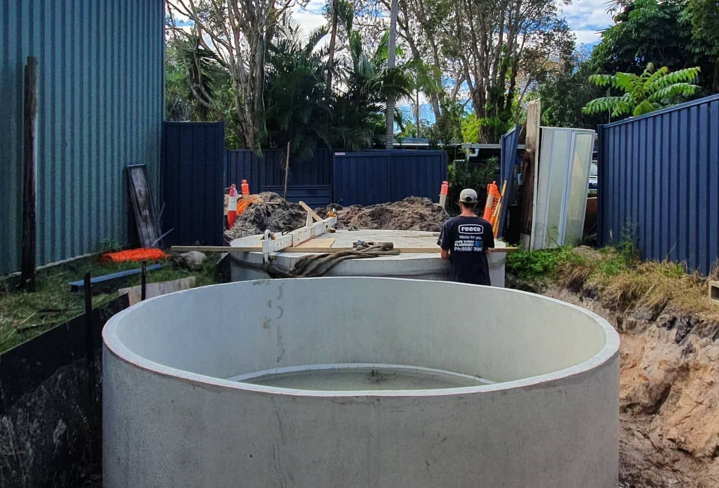 Worker Installing Rainwater Tank on the Northern Rivers