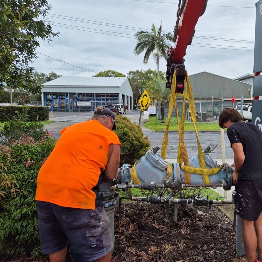 A man with an plumbing orange hi vis on - plumbing ballina, cape byron plumbing
