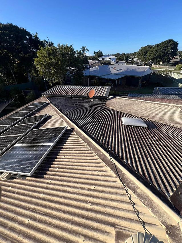 A Roof with a Lot of Solar Panels on It — Boss Roof Tiling and Restoration in Caboolture, QLD