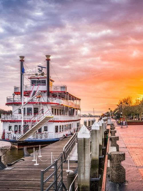 photo of boat and sunset