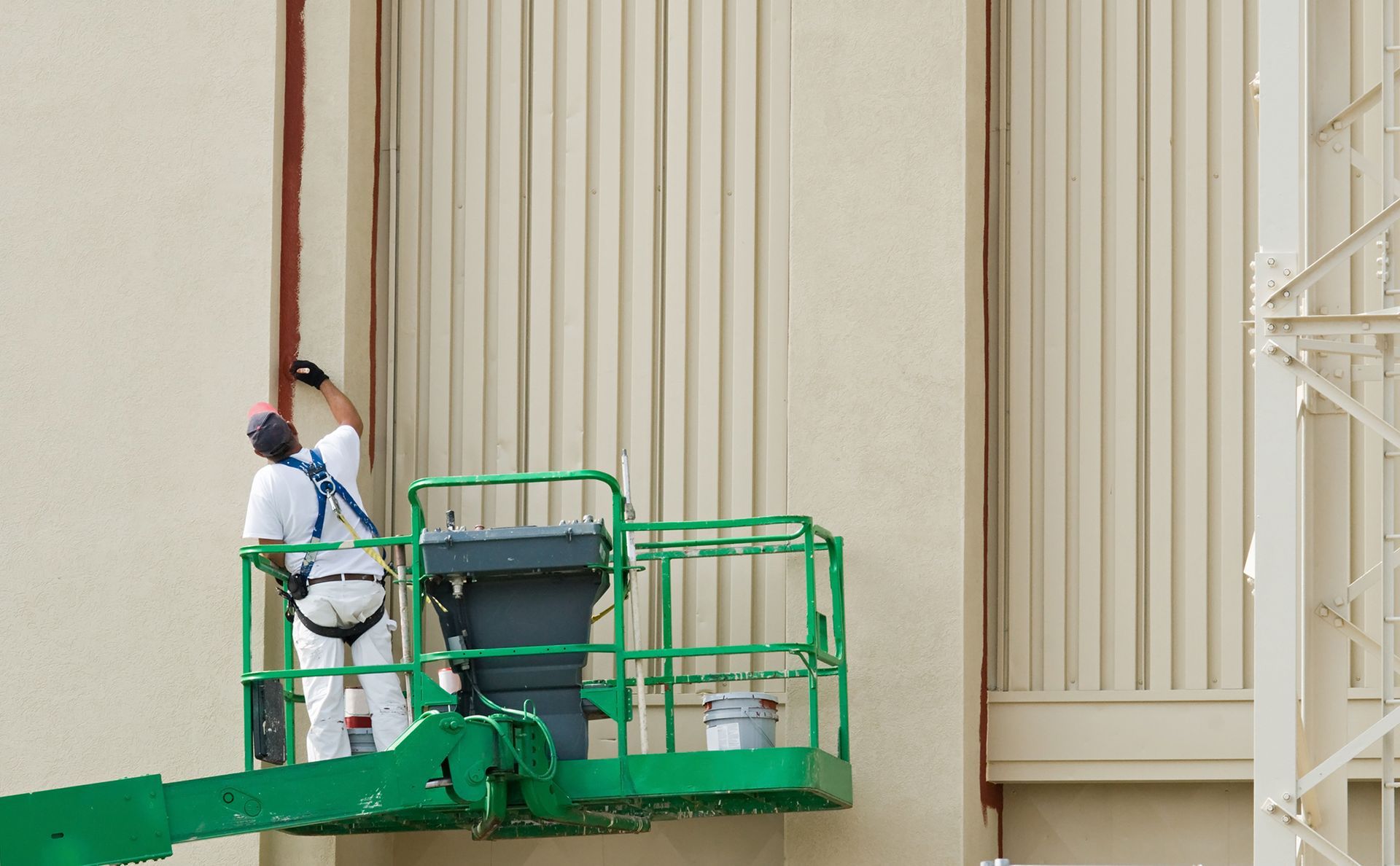 Painter on Lift — Latrobe, TAS — Clarkes Painting Services Pty Ltd