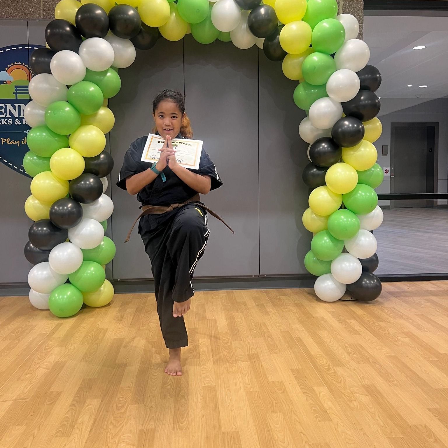 A boy and a girl are practicing taekwondo together.