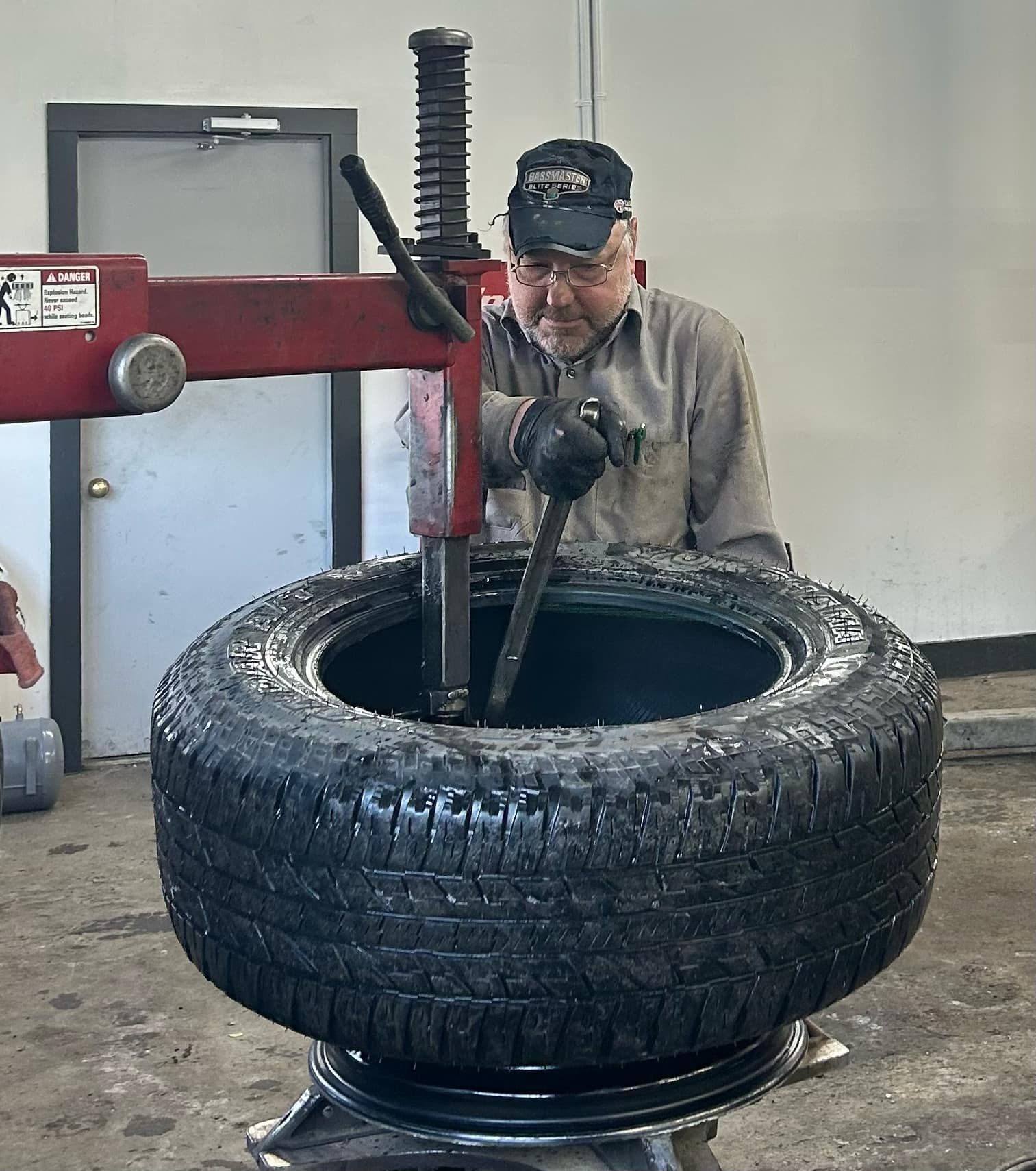 Man Working on a Tire | Value Service Center