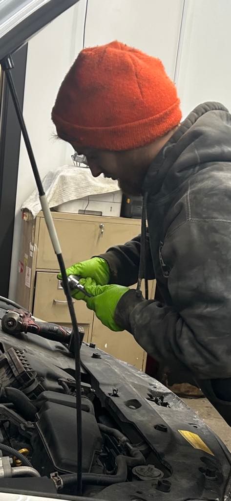 Person Doing Vehicle Work | Value Service Center