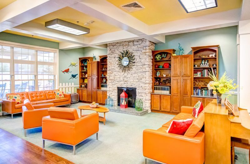 A living room filled with furniture and a fireplace.