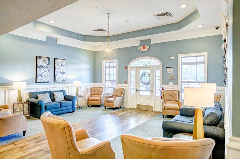A living room filled with furniture and a couch.