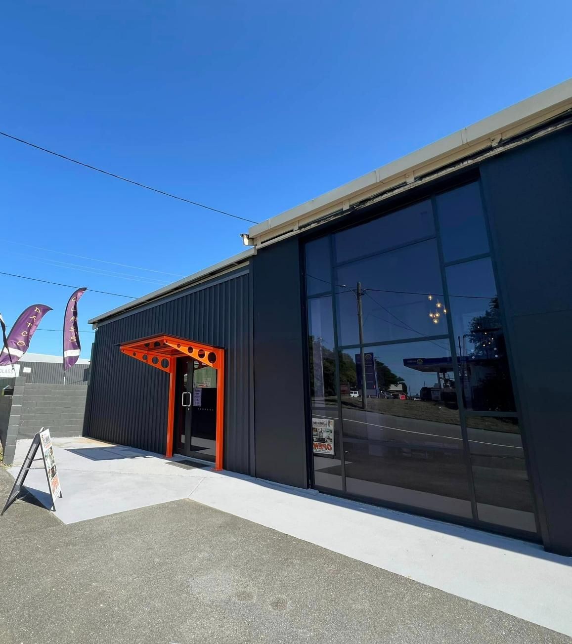 A large building with black tinted glass — Datco Group In South Murwillumbah, NSW