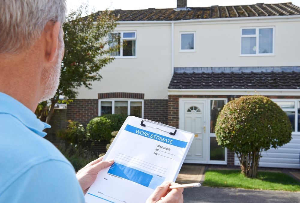 Professional Roof Worker Giving Roof Estimate