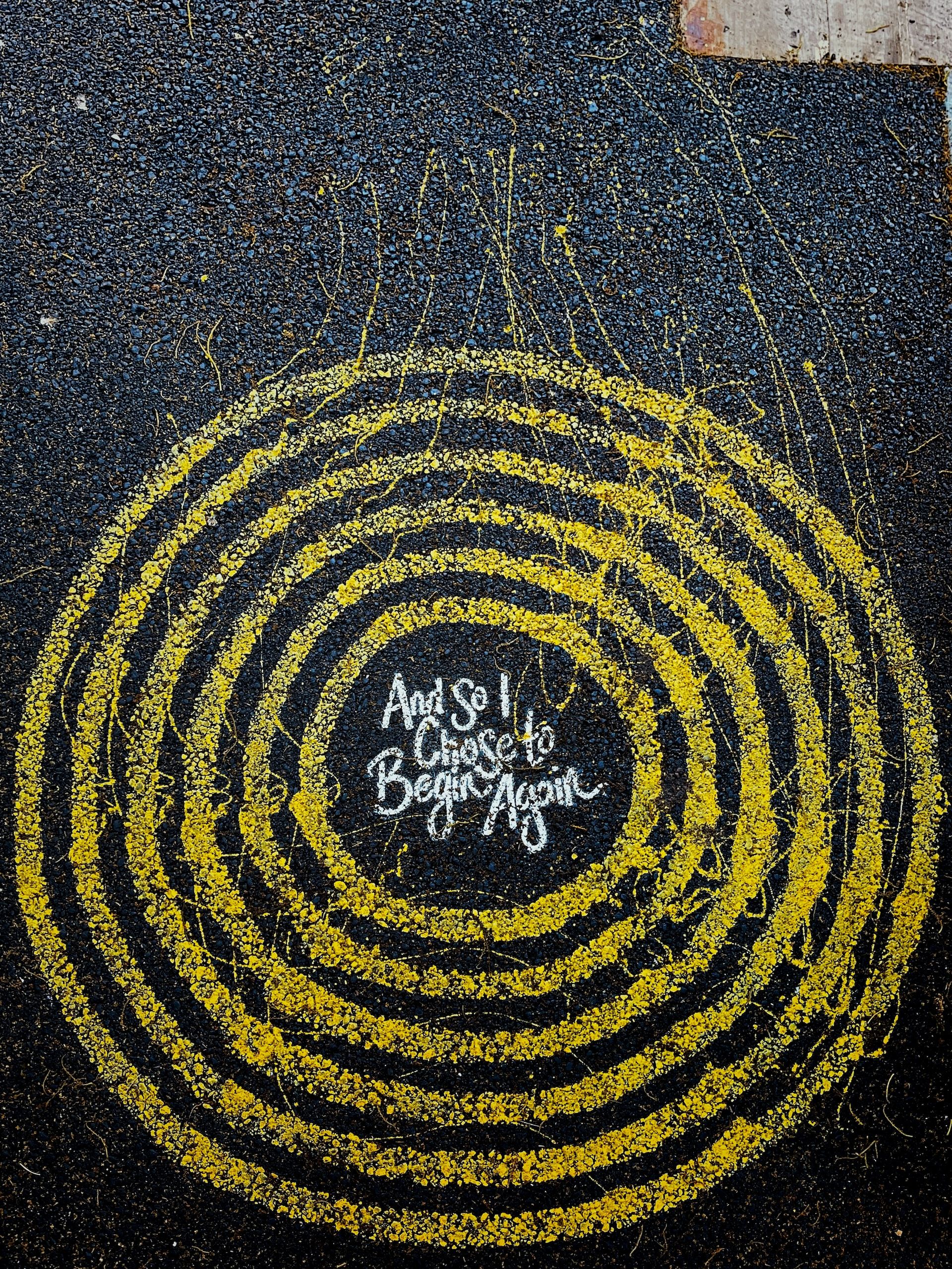 A chalk drawing of a circle with the words 