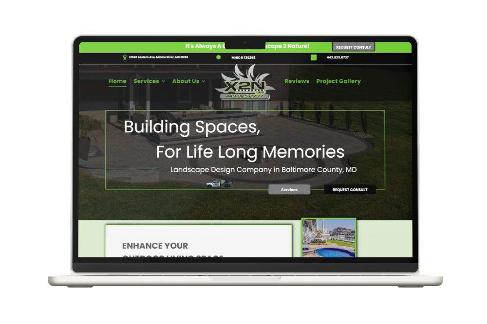 Laptop displaying a website for a landscaping company with green and white design.