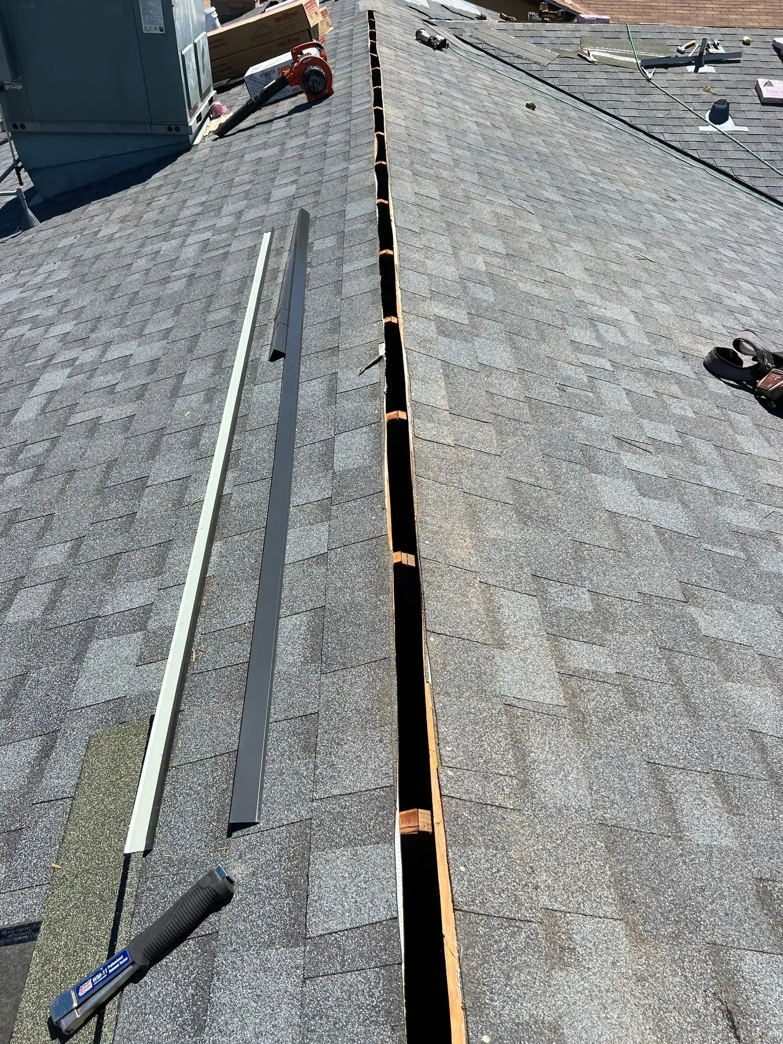A close up of a roof with a few tools on it.