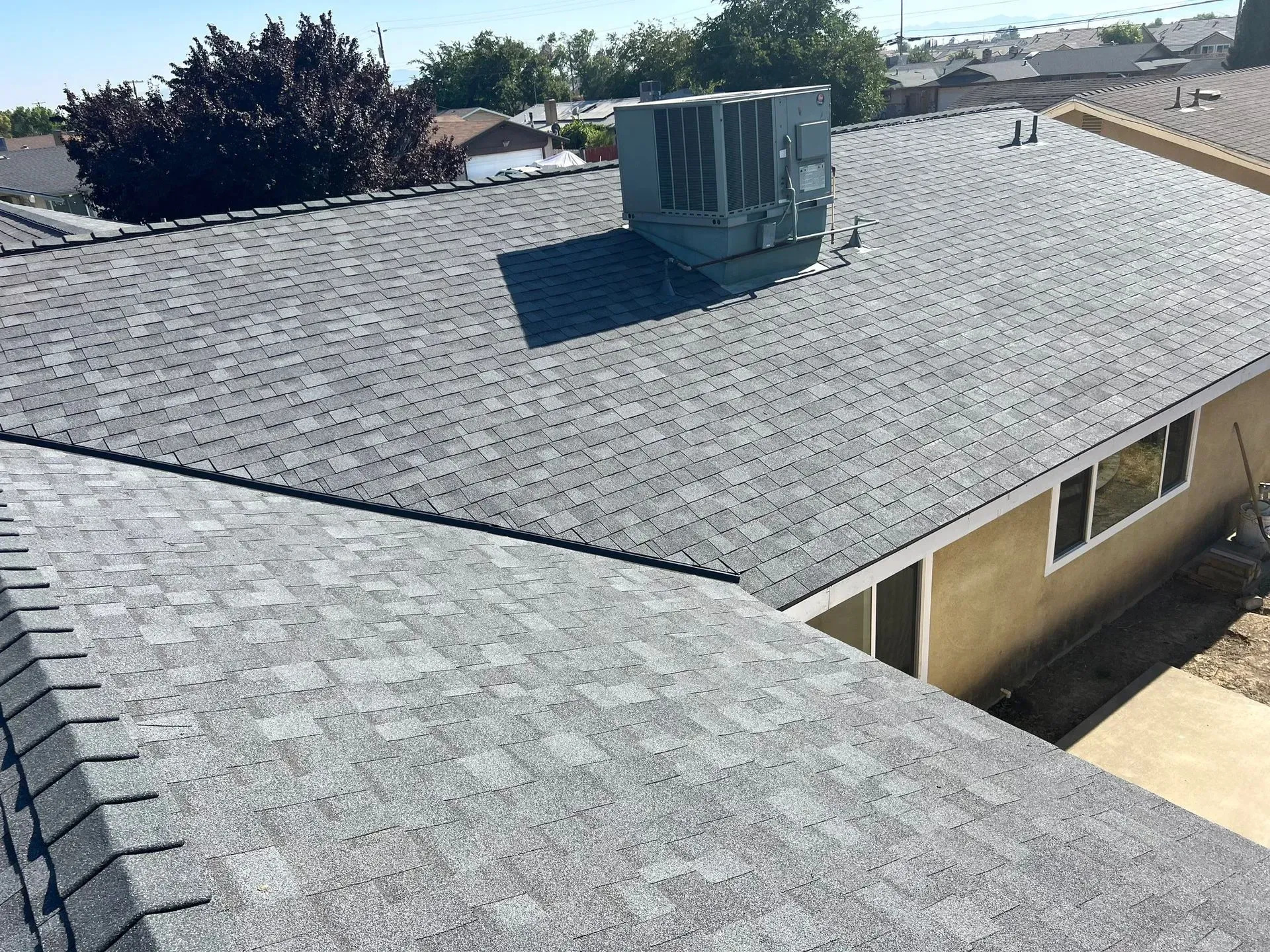 A house with a roof that has shingles on it