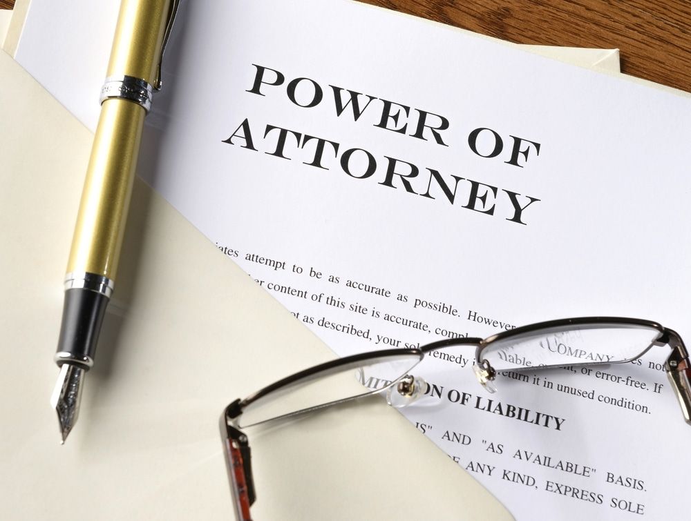 A Pen and Glasses Are on Top of A Power of Attorney — Linda Emery & Associates In Gosford, NSW