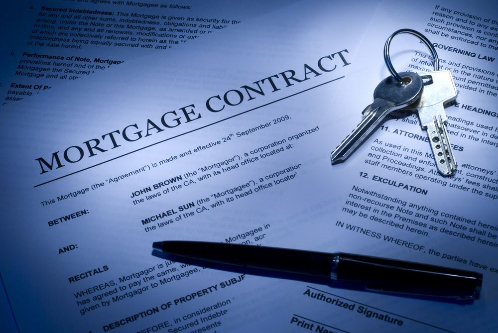 A Pen Is Sitting on Top of A Mortgage Contract — Linda Emery & Associates In Gosford, NSW