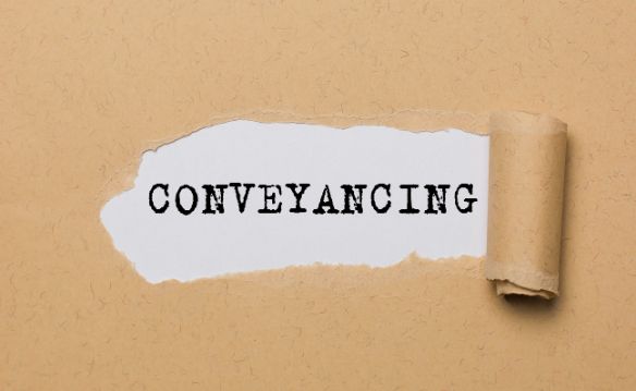 A Piece of Torn Paper with The Word Conveyancing Written on It — Linda Emery & Associates In Morisset, NSW