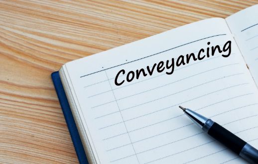 A Notebook with The Word Conveyancing Written on It — Linda Emery & Associates In Tuggerah, NSW