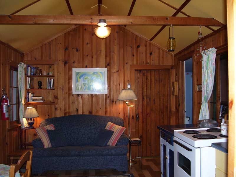 A living room with a couch and a stove