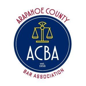 Arapahoe County Bar Association logo with gold scales on a blue circle and red text.