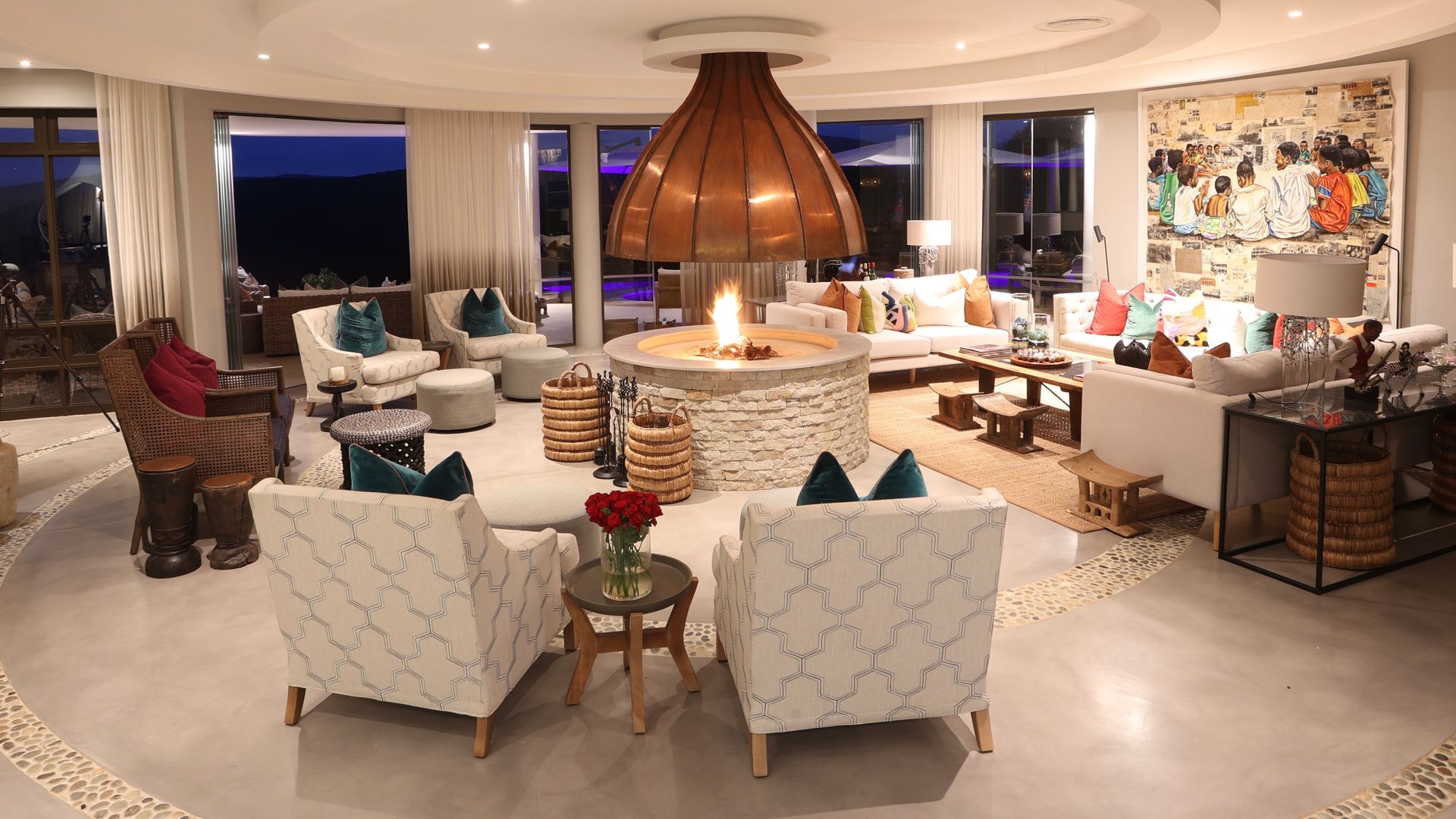 A living room with lots of furniture and a fireplace