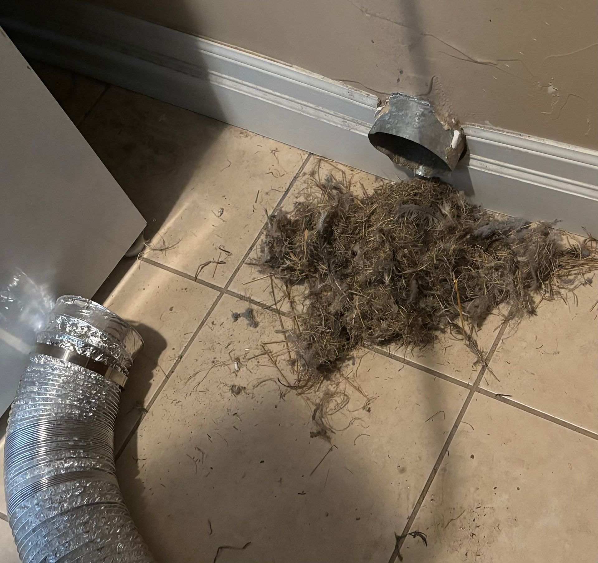 A duct with a bunch of dust coming out of it