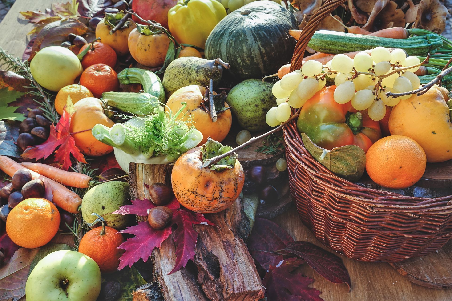 Assorted fruits and vegetables in baskets and crates at an outdoor market display