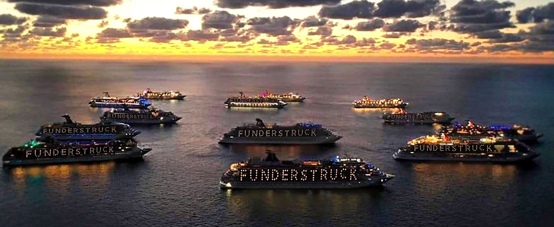 Boats on the water at sunset. Some boats have lights spelling 