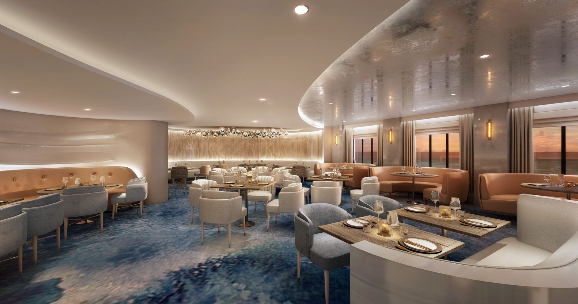 Interior of a modern restaurant, featuring round tables, chairs, booths, and a water-themed carpet.