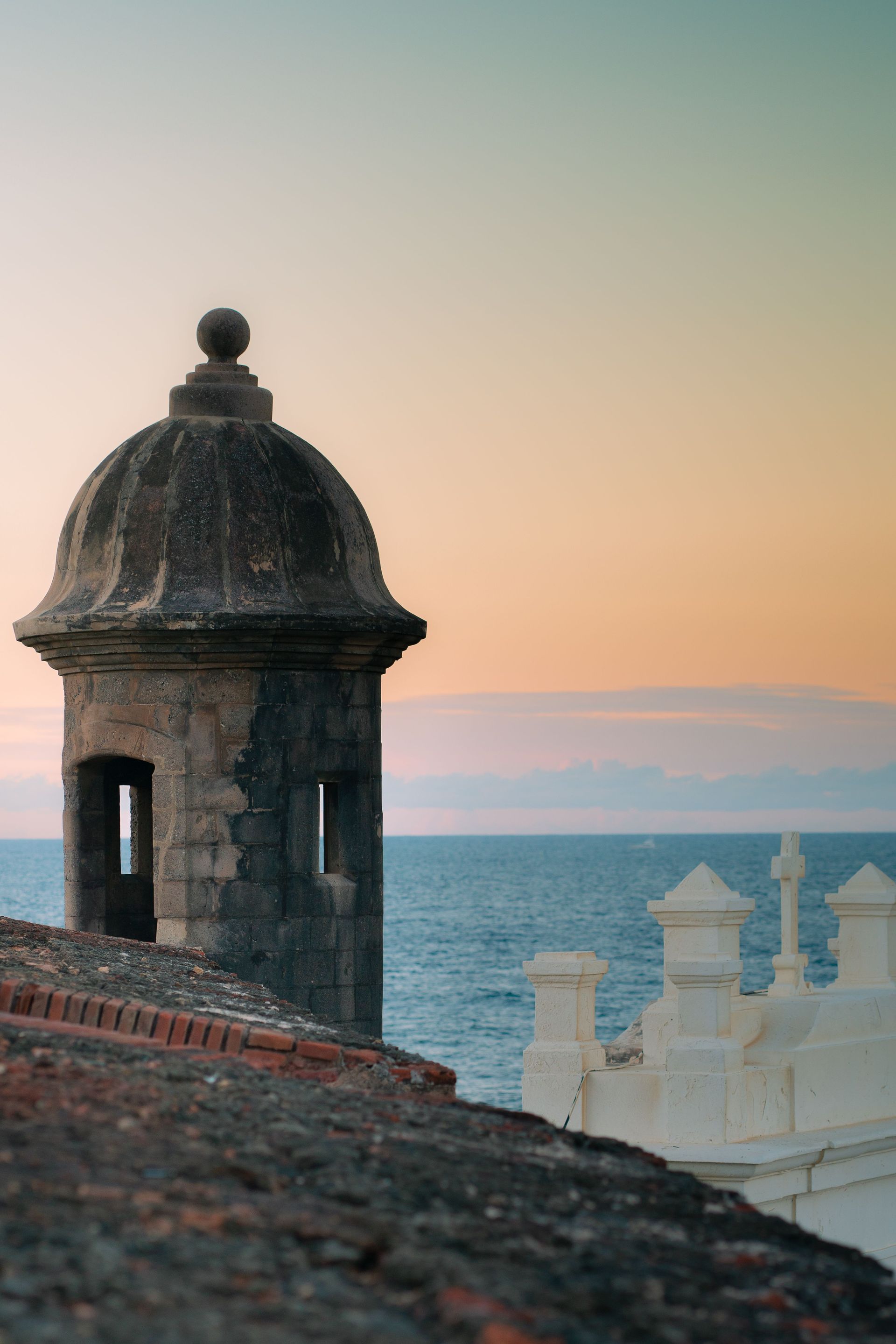 Rooftop tower at sunset overlooking the sea and distant coastline