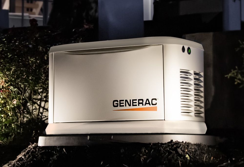 a generator is sitting in the grass next to a house