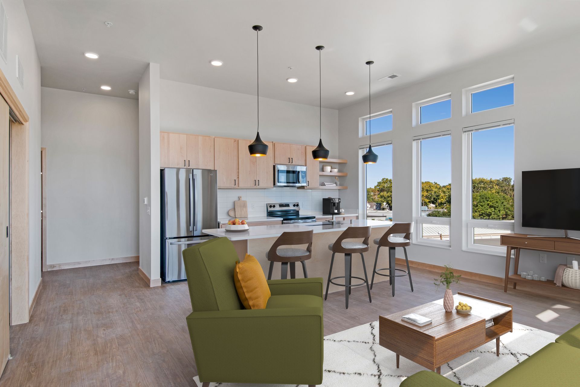 Virtually staged living room and kitchen.