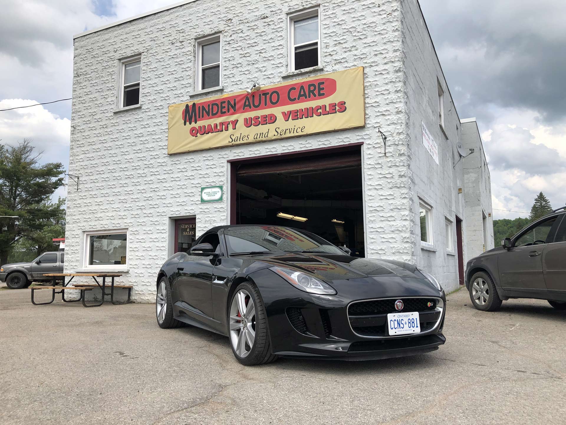 black car in front of minden autocare