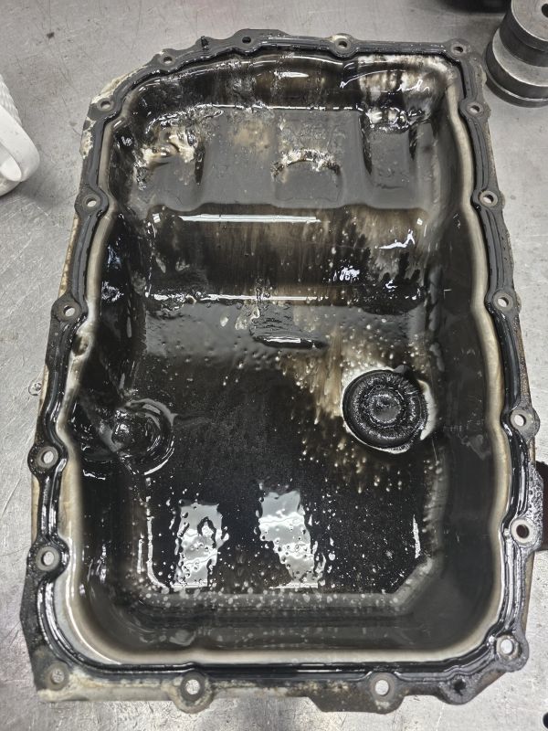 Severely contaminated transmission pan from a rebuild at Lee Myles AutoCare Hazlet NJ