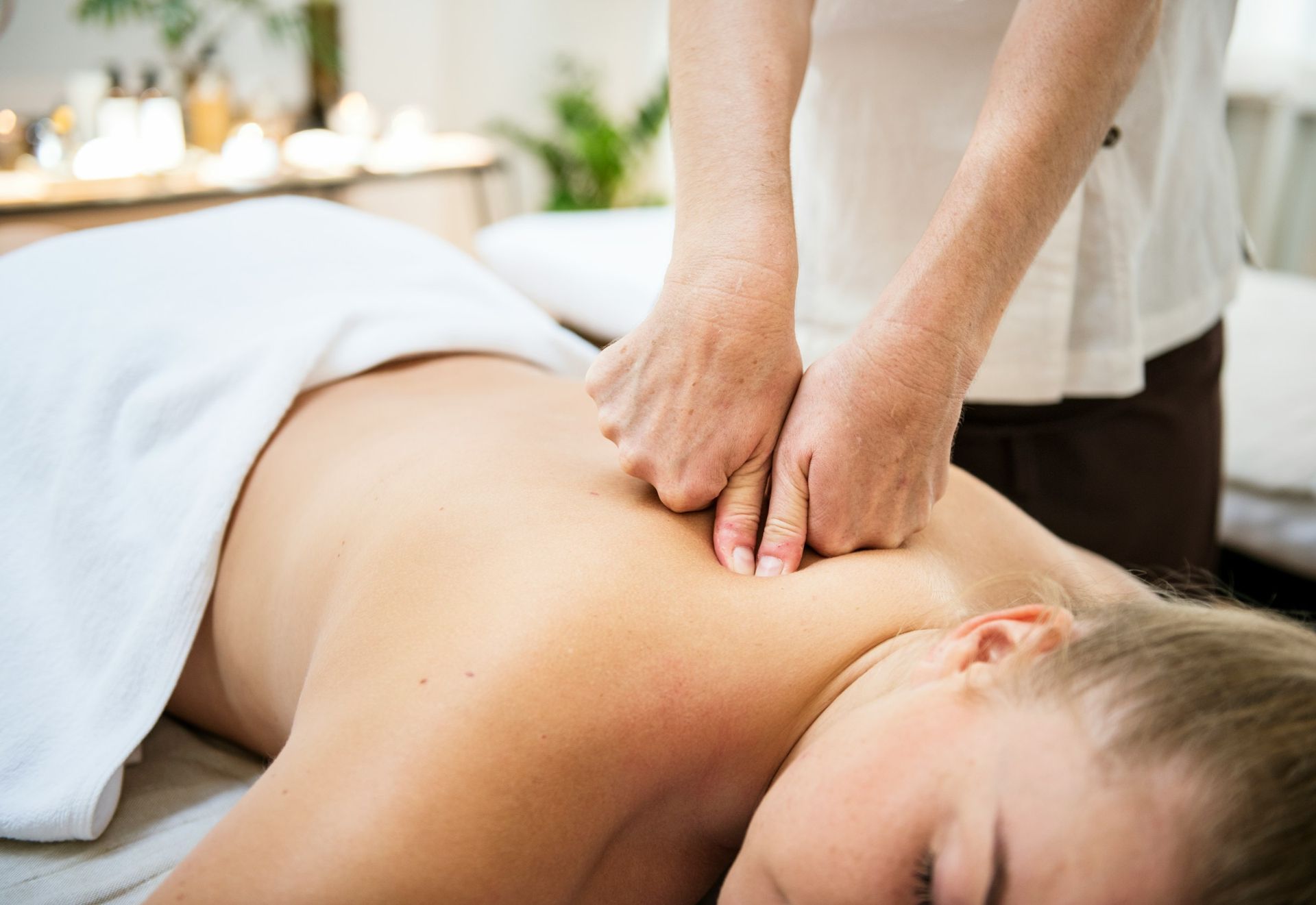 Medical massage in Buffalo with a therapist assessing a client’s symptoms, treatment goals, and area
