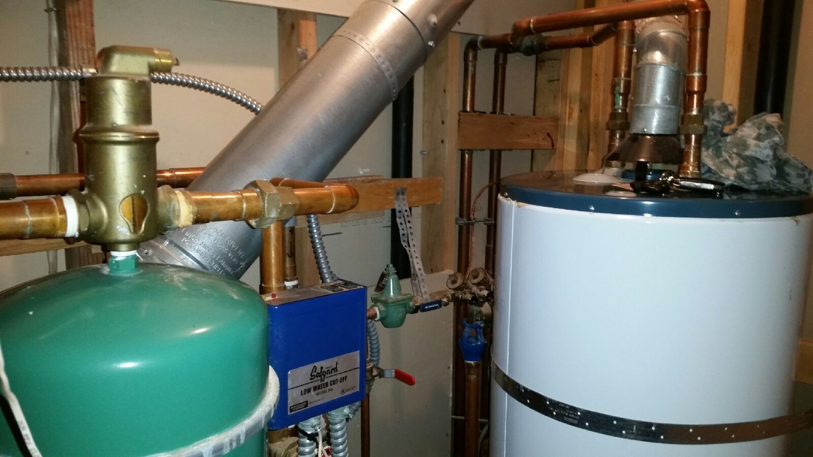 Residential boiler and water heater system installed by Kings Heating with expansion tank and safety components