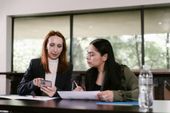 An employee mentoring a co-worker.