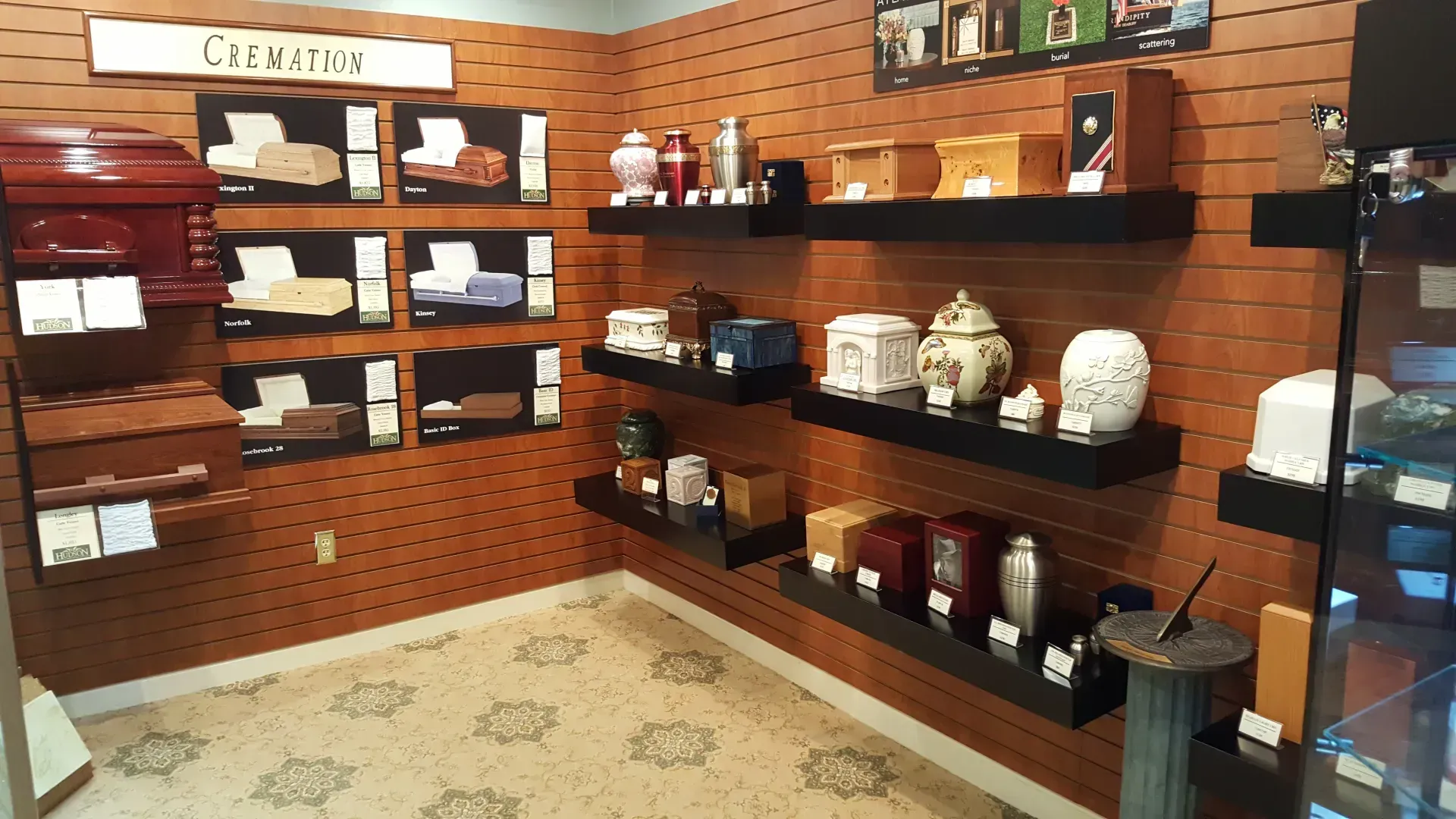 Brick-walled shop display with wooden shelves, ceramics, and packaged goods