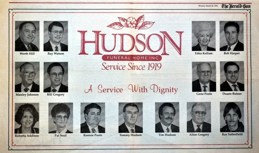 Hudson funeral home memorial banner with multiple black-and-white portraits and the slogan “A Service With Dignity”