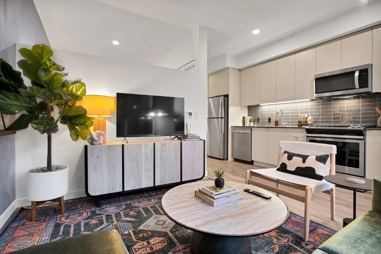 A living room filled with furniture and a flat screen tv.
