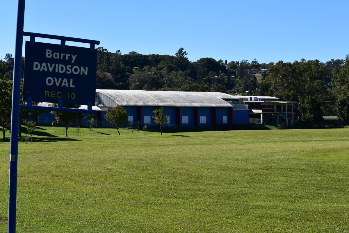 A Large Grassy Field With A Sign That Says Barry Davidson Oval — Plateau Mower Repairs In Lismore, NSW