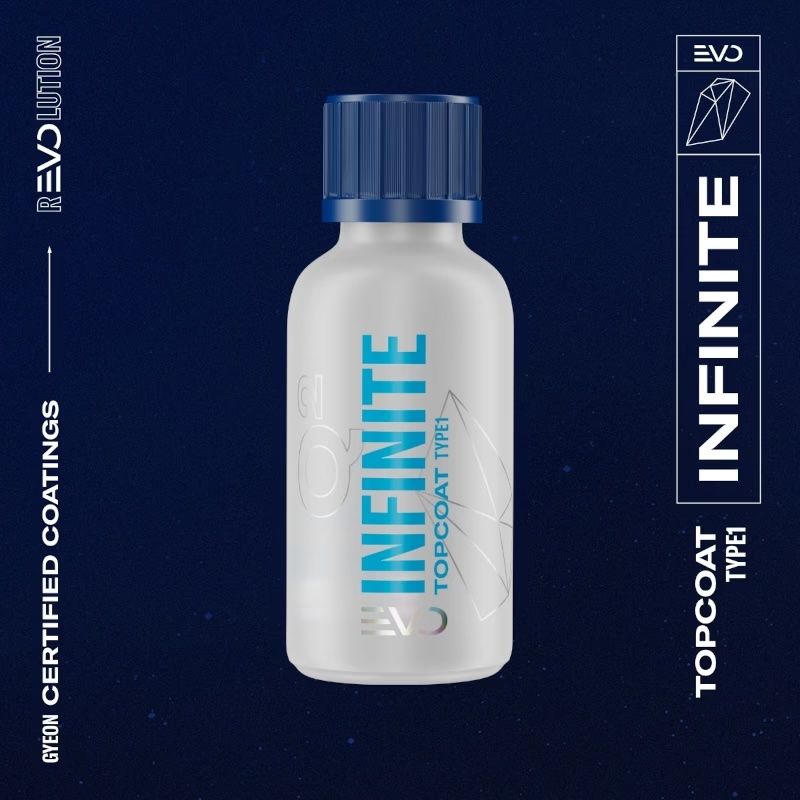 White supplement bottle with blue cap labeled “INFINITE” on a dark blue background.